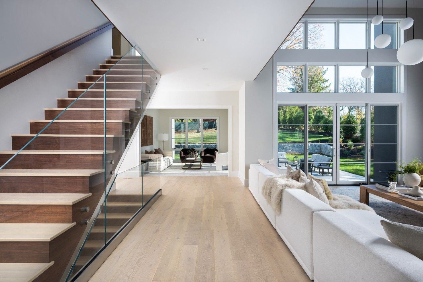 Wide-plank white oak hardwood flooring installation in a Houston home by Jamail Hardwoods