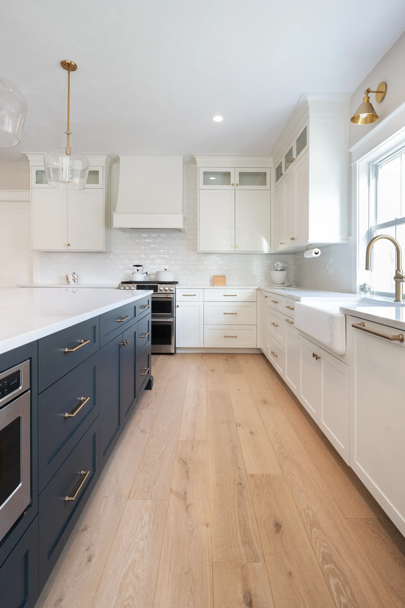 Lackey Road kitchen with navy island and white cabinetry over Mercury Character 8 inch European oak