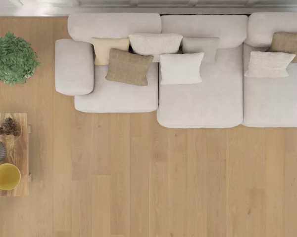 Overhead view of a modern living room with Alimia hardwood flooring, featuring a beige sofa and wooden coffee table.